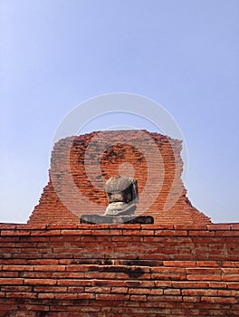 Headless, one handless of old laterite buddha statue