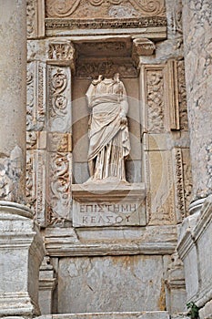 A headless statue adorns the front of the celebrated library at Ephesus