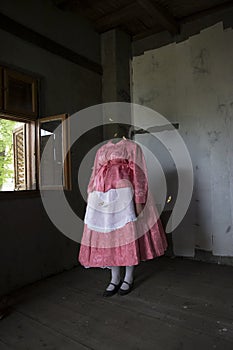 Headless woman in the folk costume. Mixed media artwork. photo