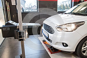 Headlight adjustment in a car by an authorized service