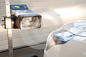 Headlight adjustment in a car by an authorized service