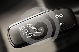Headlight adjustment knob in the car - Image