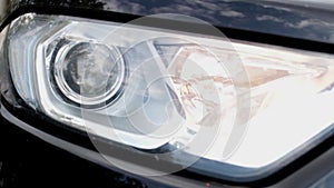 Headlight of a car turns on high beam intermittently