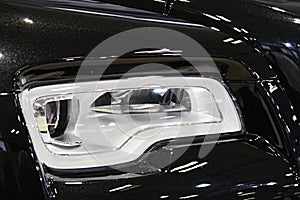 Headlight detail of modern luxurious english limousine