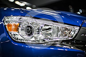 Headlight of modern blue car with led and xenon optics