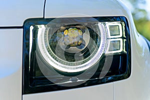 Headlight of modern prestigious car close up