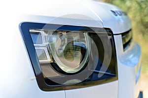 Headlight of modern prestigious car close up