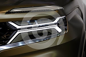 Headlight of modern prestigious car closeup