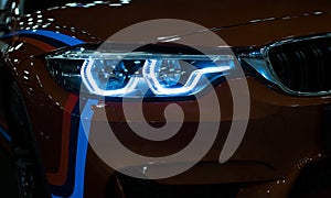 Headlight of a modern sport car.The front lights of the car. Modern Car exterior details.