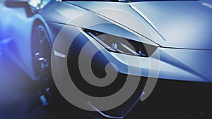 Headlight of a modern sport car. Modern Car exterior details.