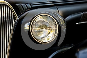 Headlight on an old American Coupe