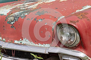 Headlight of an old rusty abandoned car, utilisation and scrap concept, copy space