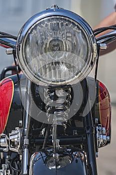 A headlight in a vintage motorcycle