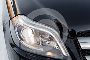 Headlights of black car