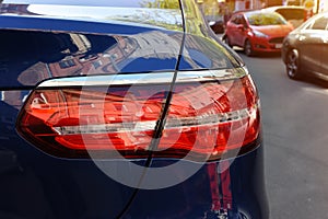 Headlights by close-up of car. Concept of expensive, sports auto closeup headlights. Back headlight