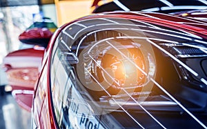 Headlights and details of red sport car