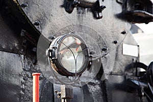 headlights on an old train, close-up, historical