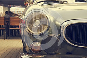 Headlights of an old vintage car.