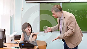 The headmaster scolds the teacher for doing bad job photo