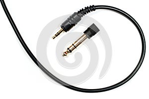 Headphone cable with 3.5 mm jack and 6.3 mm adapter.