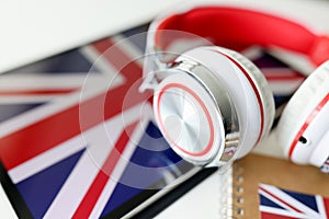 Headphones on the background of the flag of Great Britain
