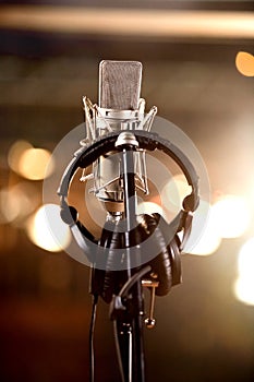 Headphones and Condenser Microphone in a Music Recording Studio