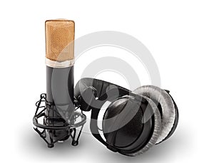 Headphones and condenser microphone on the white background