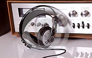 Headphones connected to vintage audio stereo