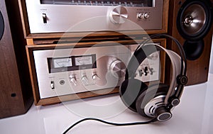 Headphones connected to vintage audio stereo