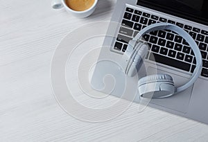 Headphones, laptop and coffee
