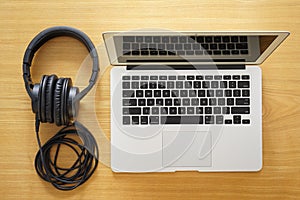 Headphones and laptop for modern working