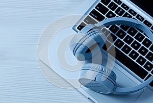 Headphones and laptop on table