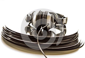 Headphones lying on the stack of vinyl records.