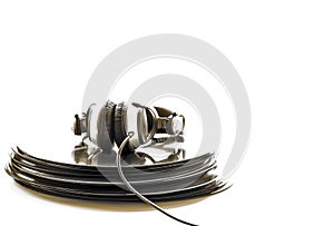 Headphones lying on the stack of vinyl records. photo