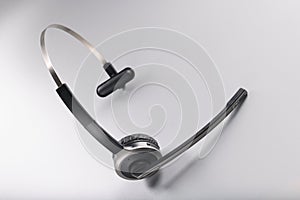 Headphones with microphone on grey background, gadget for listening music and sing