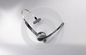 Headphones with microphone on grey background, gadget for listening music and sing