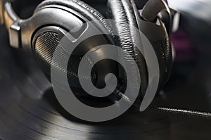 Headphones over vinyl record