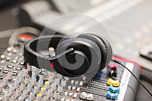 Headphones on Sound Mixer In Professional Radio Studio
