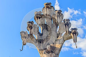 7 heads naga and the Buddha at Sala Keoku, the park of giant fan photo