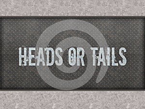 HEADS OR TAILS painted on metal panel wall.