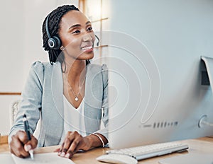 Headset, call center and black woman use computer working at desk in office or work online from home. Smile, female