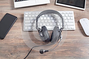 Headset on computer keyboard. Customer service. Support