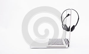 Headset and computer laptop, call center support.