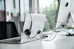 Headset and customer support equipment at call center ready for actively service