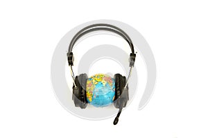 Headset on globe isolated on the white