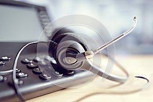 Headset headphones and telephone in call center