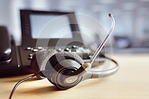 Headset headphones and telephone in call center