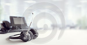 Headset headphones telephone on desk in call center