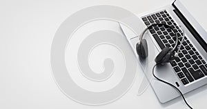 Headset on a laptop computer keyboard background