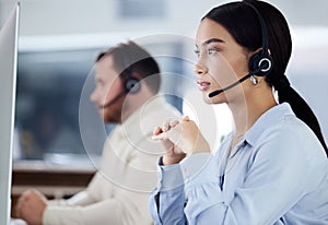 Headset, listening and woman for customer service in office, workspace and job working in call center for telemarketing